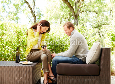 stock-photo-26640968-couple-holding-wine-glasses-at-resort