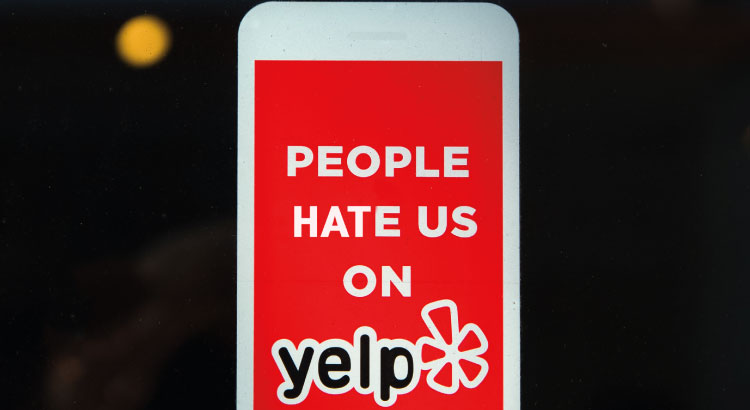 Firing back at bad reviews will only make the situation worse. People hate us on Yelp campaign logo