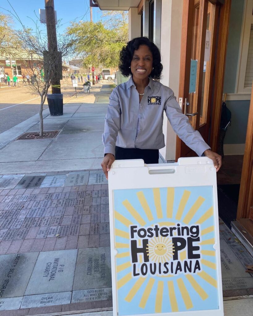 lady holding a frame sign sandwich board