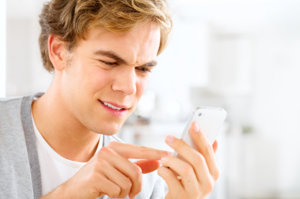 Frustrated man sending text
