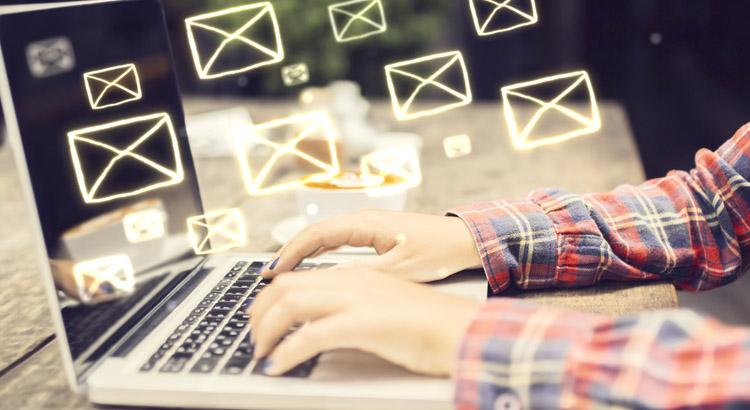 Marketer using a laptop for email marketing